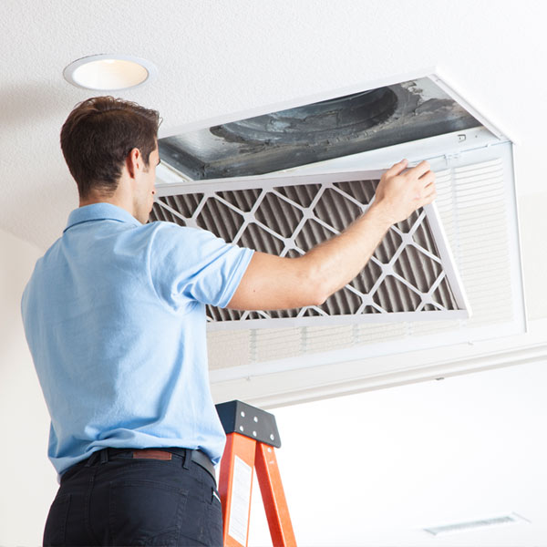 Man replacing air filter - Air Conditioning Repair and Installation In Bardstown, KY | Above All Mechanical
