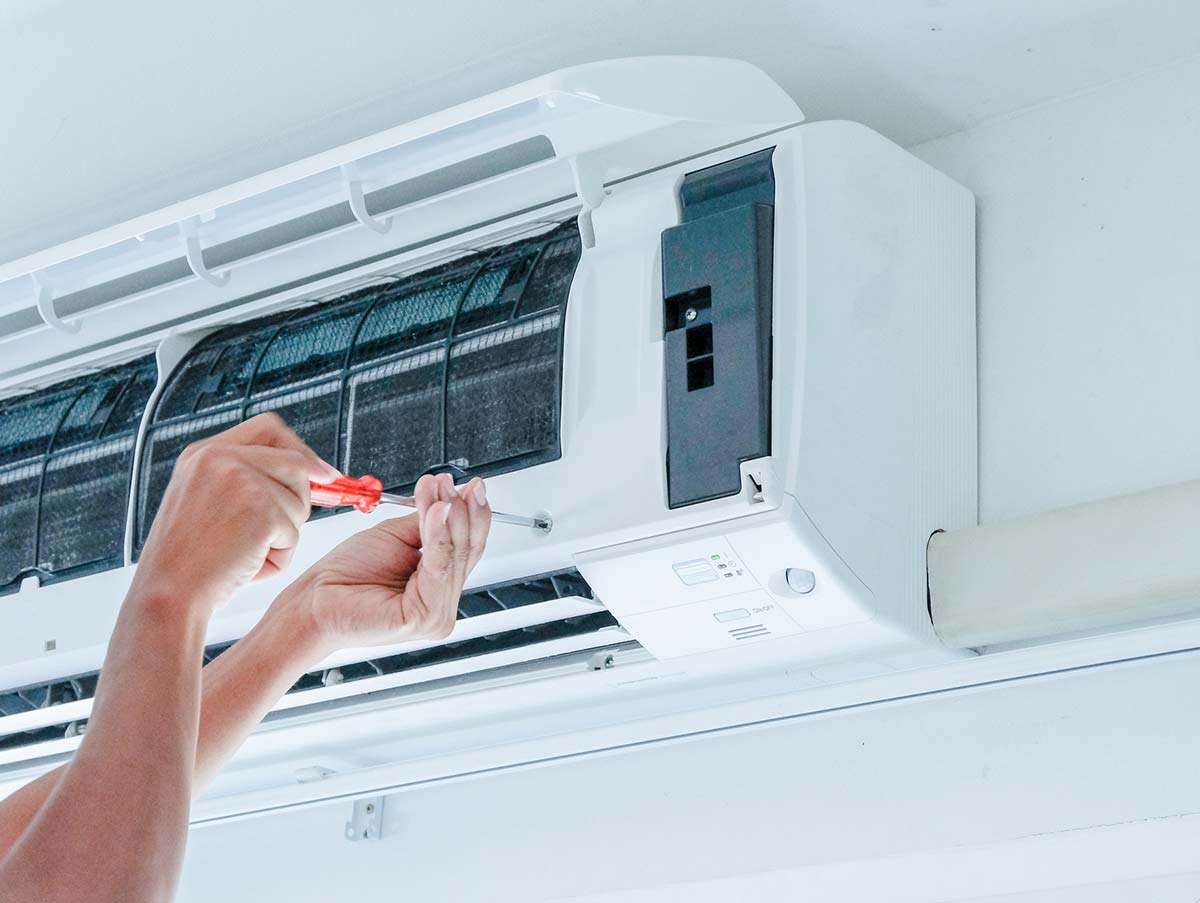 tech unscrews cover of ac for service - Air Conditioning Repair and Installation In Bardstown, KY | Above All Mechanical